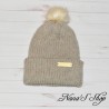 Bonnet tricoté mains, à revers et à pompon, en acrylique, coloris beige,